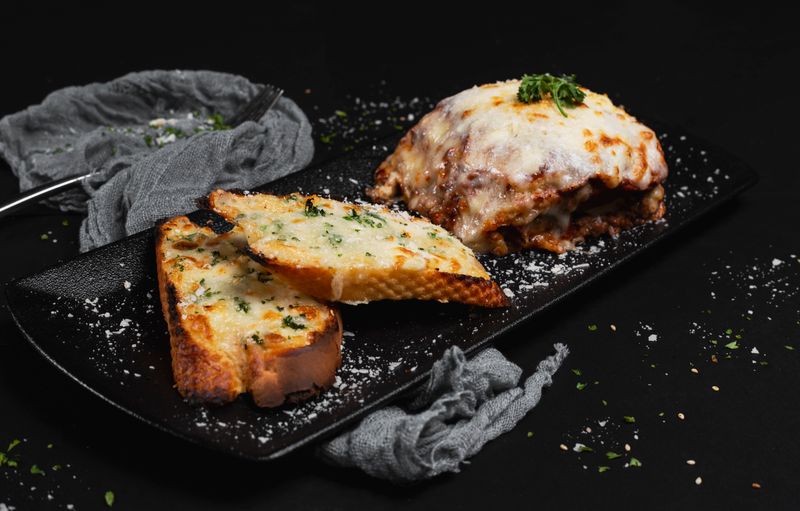 Cheesy garlic bread with herbs fresh from the oven