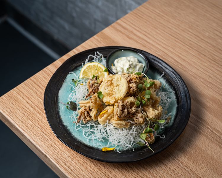 Crispy fried calamari with lemon and dipping sauce