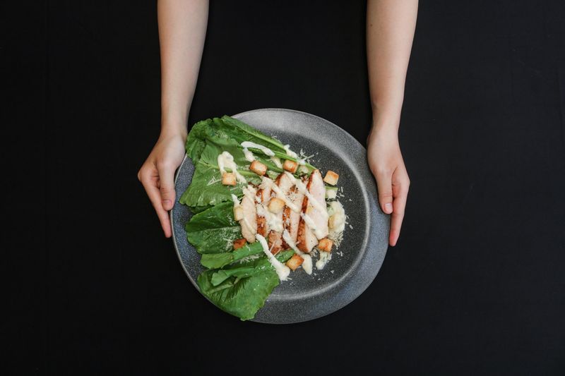 Fresh Caesar salad with romaine lettuce croutons and parmesan