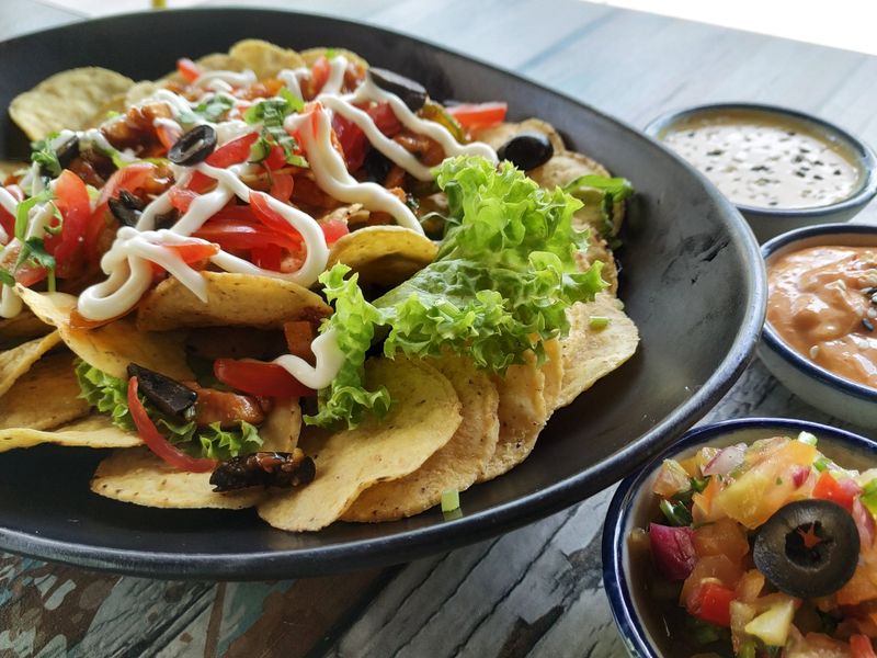 Loaded nachos with cheese jalapeños and sour cream