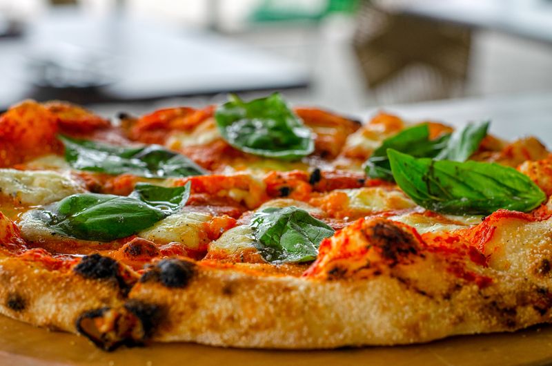 Pizza factory classic margherita pizza with fresh basil and mozzarella
