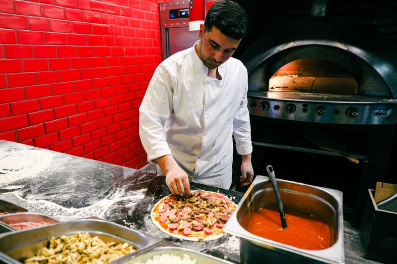 Pizza factory kitchen and handcrafted pizzas at our Dayton location