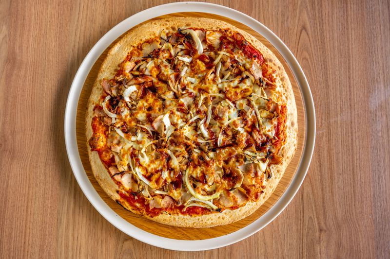 Spicy pepperoni pizza with double cheese from the pizza factory