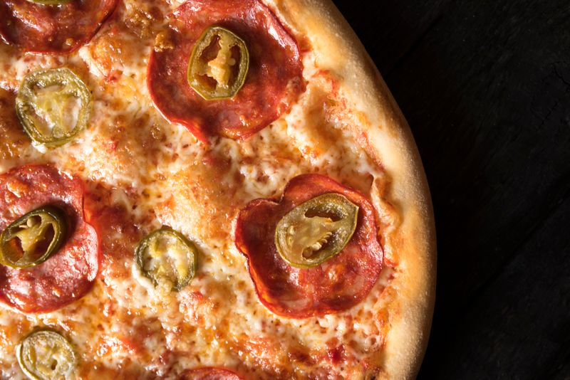 BBQ chicken pizza with smoky sauce and caramelized onions