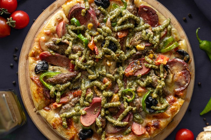 Garden vegetable pizza with seasonal toppings and fresh herbs